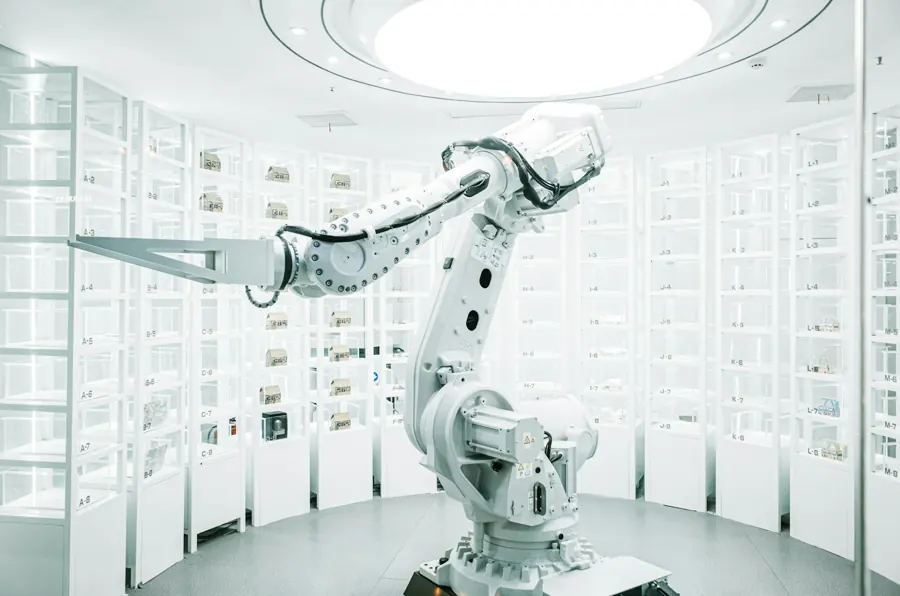 White industrial robotic arm in a bright showroom